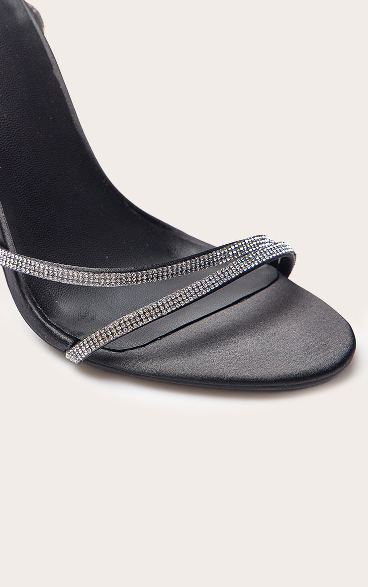 https://cdn-img.prettylittlething.com/0/0/7/8/00782b4cf84aee9ae989359d7087bb3dbebbff97_CNO4770_5_black_satin_diamante_round_toe_asymmetric_high_stiletto_heeled_sandals.jpg