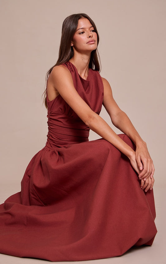 https://cdn-img.prettylittlething.com/0/2/2/e/022e52a4707fa50b9ea5a7a2118178369fcb3aca_CNO2457_1_deep_red_boat_neck_ruched_detail_puffball_maxi_dress.jpg