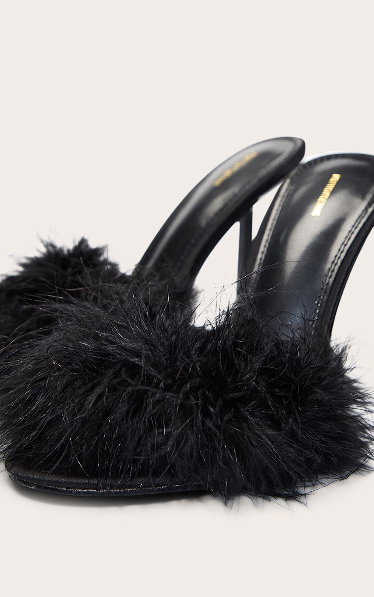 https://cdn-img.prettylittlething.com/0/5/0/c/050cf012bb343e5e717ec1e2952ca8c2411a16c2_CNO2801_5_black_feather_heeled_mule.jpg
