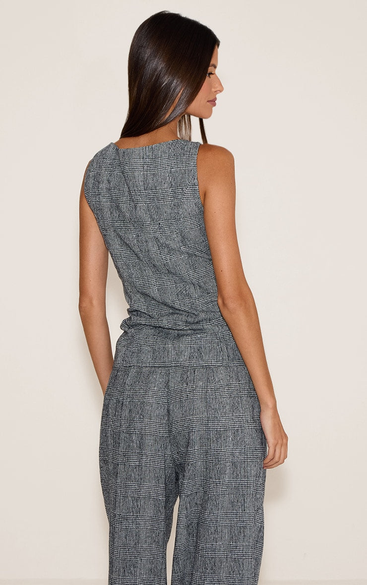 https://cdn-img.prettylittlething.com/a/0/a/8/a0a8aacbfec3c8f33996ffe086fa4abd7a2b0dc2_CNO0666_2_grey_checked_woven_waistcoat.jpg